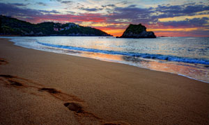 黃昏夕陽大海沙灘風景攝影高清圖片