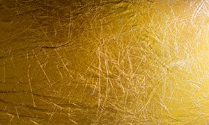 褶皺效果金黃色的紋理背景高清圖片