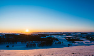 冬季夕阳下的雪后美景高清摄影图片